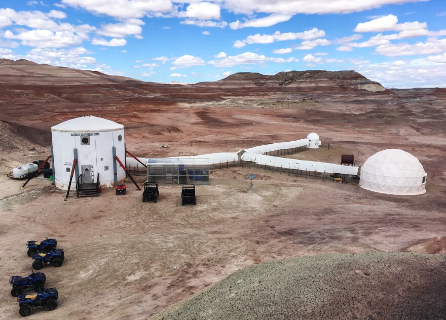 The Mars Desert Research Station in southern Utah. Living quarters are in the cylinder on the left, connected to the small observatory, science lab (far right) and a greenhouse.