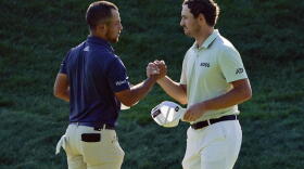 Xander Schauffele, left, and Patrick Cantlay shake hands after finishing the third round of the Travelers Championship golf tournament at TPC River Highlands, Saturday, June 25, 2022, in Cromwell, Conn. Schauffele finished one stroke ahead of Cantley for the lead heading into the final round on Sunday.