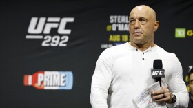 Joe Rogan is seen at the ceremonial weigh-in for the UFC 292 mixed martial arts event, Friday, August 18, 2023, in Boston.