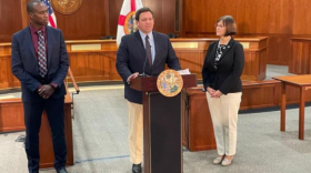 Gov. Ron DeSantis, flanked by Surgeon General Joseph Ladapo and state Rep. Cyndi Stevenson, announced Florida will challenge federal vaccination requirements. (Tom Urban/News Service Florida)