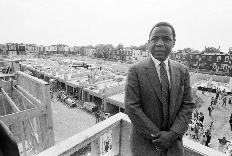 Philadelphia Mayor Wilson Goode stands on the roof of a newly constructed home, Sept. 17, 1985, on the site of the deadly battle with the group MOVE. Homeowners burned out as a result of the police siege of the MOVE headquarters watched the rebuilding process with skepticism.