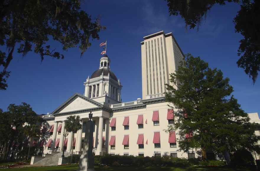 FILE - This Tuesday April 23, 2019 file photo shows the Florida Capitol in Tallahassee, Fla. On Monday, April 29, the Florida Legislature heads into its final scheduled week with a host of major issues still to be settled, including a roughly $90 billion state budget that is the only bill lawmakers must pass. (AP Photo/Phil Sears)