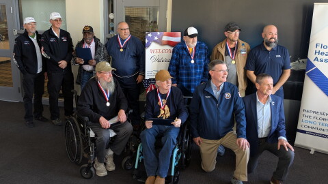 The 6 Dream Flight recipients pose for a pre-flight photo with