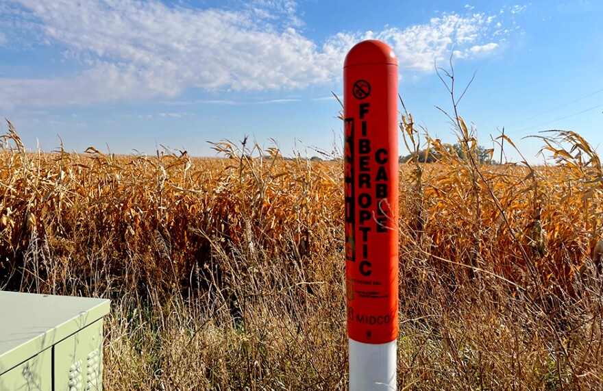 An orange post indicates the presence of fiber optic cables.