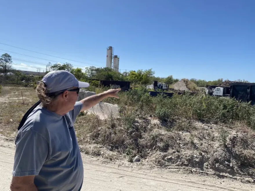 Mark Firing points toward his home just beyond this site on Gator Road, where state regulators ordered a hazardous-waste cleanup.