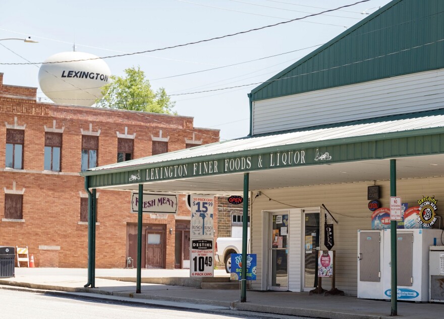 Downtown grocery store in front of water tower