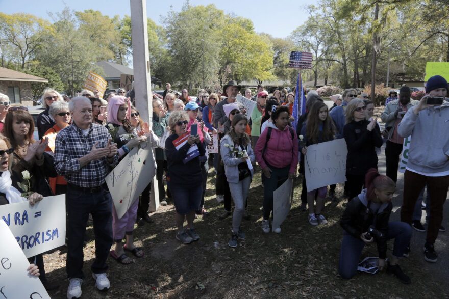 Supporters of gun control met at the Gainesville District Office of Congressman Ted Yoho March 14, 2018. Students from Trilogy School, faculty and other supporters of gun control marched from the gates of Buchholz High School to the Republican's office to demand action against gun violence.[Kaila Jones/WUFT]