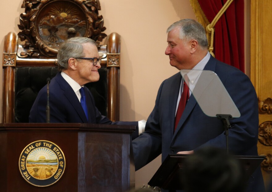 Ohio Governor Mike DeWine, left, shakes hands with Ohio House speaker Larry Householder after delivering the Ohio State of the State address at the Ohio Statehouse in Columbus, Ohio, Tuesday, March 5, 2019.