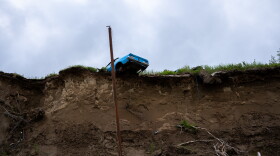 A car on the edge of a cliff over the Wood River