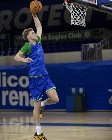 Seven-footer Justin Houser dunks during practice on Monday, Sept. 21, 2026, at FGCU’s Alico Arena.
