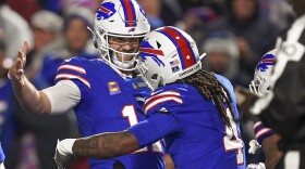 Buffalo Bills running back James Cook (4) celebrates with quarterback Josh Allen (17) after scoring touchdown against the Dallas Cowboys during the second quarter of an NFL football game, Sunday, Dec. 17, 2023, in Orchard Park, N.Y. (AP Photo/Adrian Kraus)