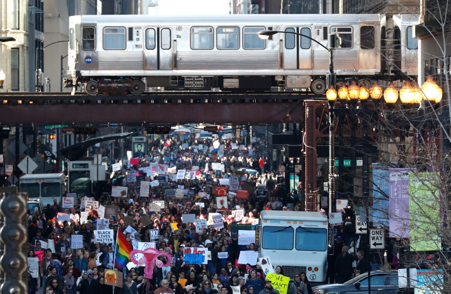Protesters make their way through Chicago during the city's women's march.