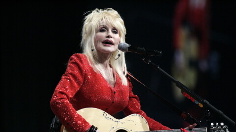 FILE - Dolly Parton performs at a United Way of America convention in Detroit, Friday, May 15, 2009.