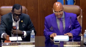 2 men at a Monroe City Council meeting