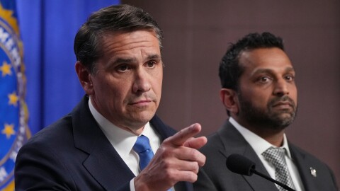 Acting Attorney General Todd Blanche speaks as FBI Director Kash Patel listens during a news conference at the Justice Department, Tuesday, April 21, 2026, in Washington.