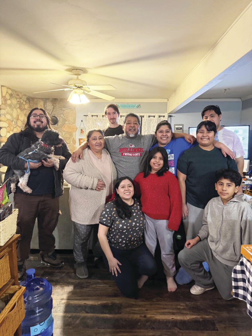 Fernando Ramirez (middle, wearing a Fresno State shirt) embraces his family after his Jan. 10 release from US Immigration and Customs Enforcement detention in Baldwin.