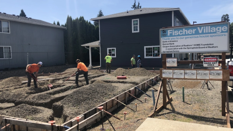 Workers in 2022 building the now completed Fischer Village low-income housing complex in Springfield