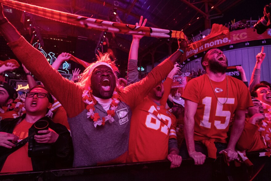 Chiefs fans at KC Live! in downtown Kansas City go crazy over Patrick Mahomes' touchdown in the first quarter of the Super Bowl.