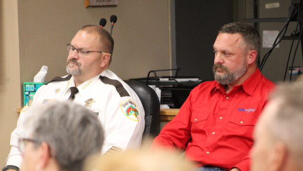 Sheriff Bryan Welk and his opponent, Deputy Aaron Ammerman, watch the forum preceding the sheriff's candidate forum Sept. 8, 2026, at Sylvan Town Hall in southern Cass County.