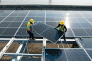 Workers are installing solar panels