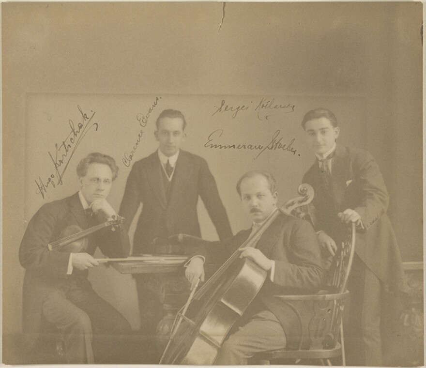 Sepia-tone image of the four members of the Berkshire Quartet, in late 19th-century concert attire.