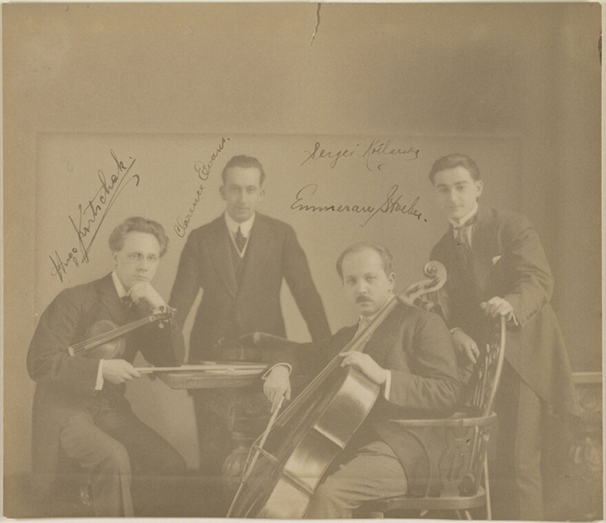 Sepia-tone image of the four members of the Berkshire Quartet, in late 19th-century concert attire. 