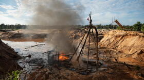 FILE - Members of the Peruvian Navy destroy a dredge used for illegal mining near the Malinowski River in the Tambopata National Reserve in Puerto Maldonado, Peru, Aug. 11, 2026. (AP Photo/Guadalupe Pardo, File)