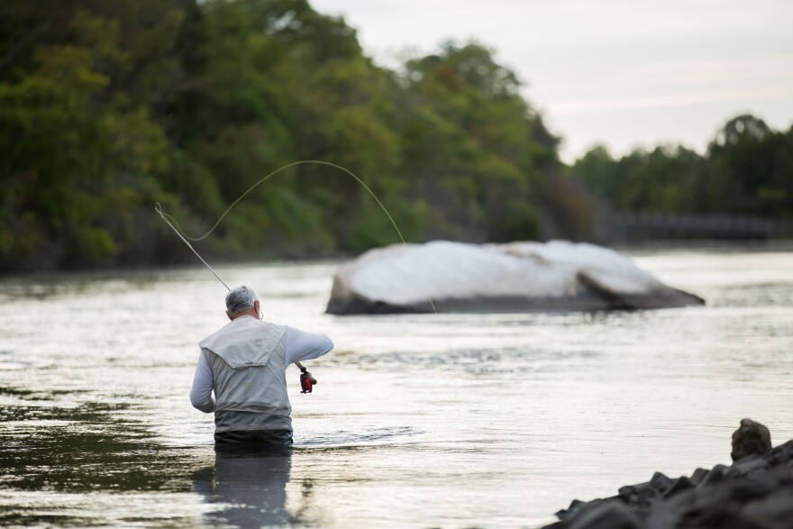 This stock image shows a fisherman at Sunken Meadow State Park.