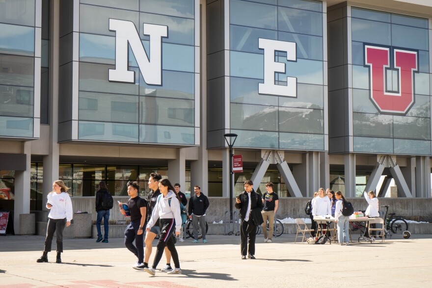 Students on the plaza in front of the J. Willard Marriott Library on the campus of the University of Utah in Salt Lake City, March 29, 2023.