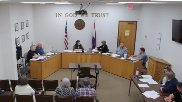 Forsyth's Board of Aldermen discuss a resolution funding impeachment proceedings against the town's mayor. Mayor Julie AuBuchon is in the middle; alderman Scott Novak is at the far-right.