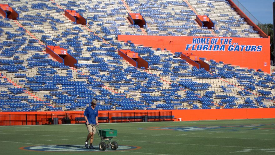 On Monday, Sept. 1, 24-year-old turf groundskeeper John Wagnon fertilizes the Ben Hill Griffin Stadium after UF's opening game against Idaho was canceled on Saturday. The game was called after severe weather caused significant delays and left the field unsafe.