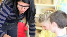 A staff member works with children at Centro VIDA Children's Center. (Courtesy of the Center for the Study of Child Care Employment)