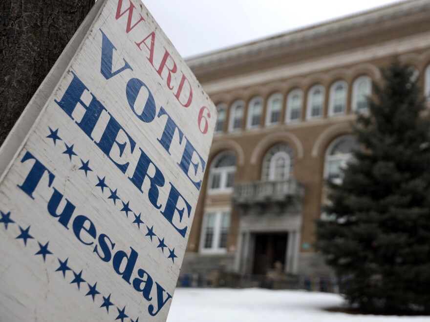 A "Vote Here Tuesday" sign is seen in Burlington, Vt., in 2020. In 2023, the city voted to allow non-U.S. citizens who are in the country legally to vote in local elections. But their turnout remains low.