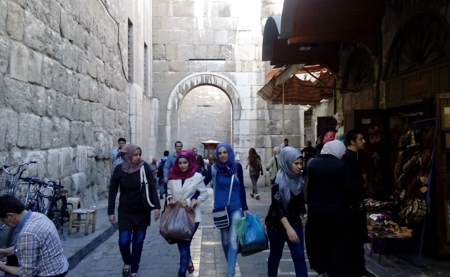 The streets of Damascus are still filled with shoppers.