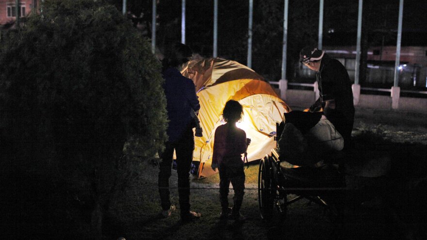 A family sets up a tent for the night in Kathmandu. A second earthquake hit the country just weeks after the first quake struck.