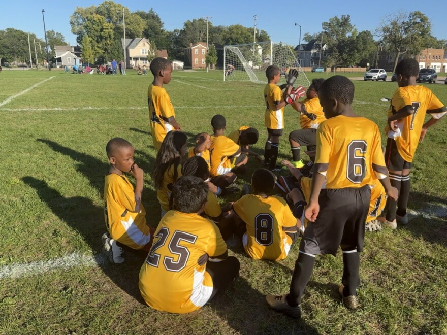 Constance Lane Elementary School's Fourth Grade soccer team huddles up on the side of the field during their game