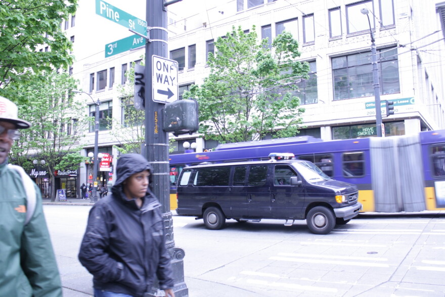 A police van at Third Avenue and Pine Street in downtown Seattle.