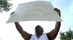 Barbara Jackson, of Sanford, Fla., protests outside the Seminole County Courthouse during the George Zimmerman trial Tuesday, June 11, 2013, in Sanford. (Phelan M. Ebenhack/AP)