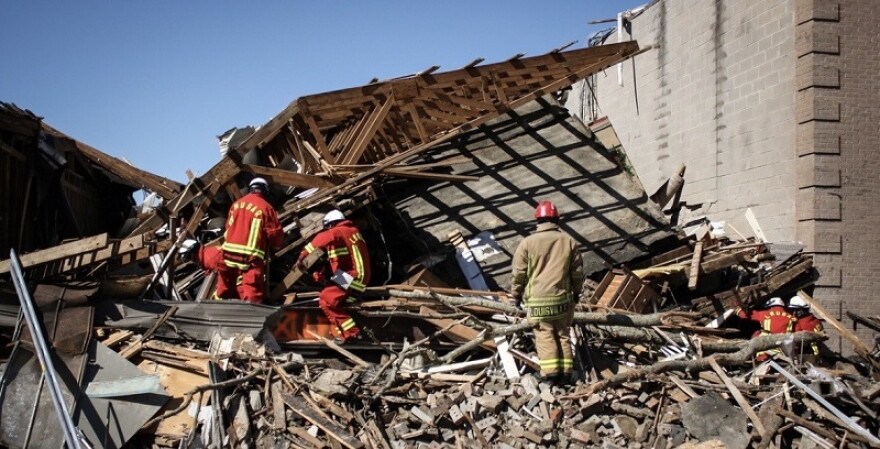 Rescuers searched the old Martin's Department Store the day after the 2012 EF3 tornado tore through West Liberty.