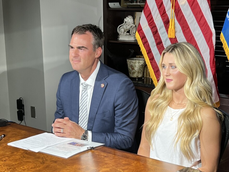  Oklahoma Gov. Kevin Stitt (left) and former college swimmer Riley Gaines are seated for an interview with Fox News on the same day Stitt signed a "Women's Bill of Rights" Executive Order.