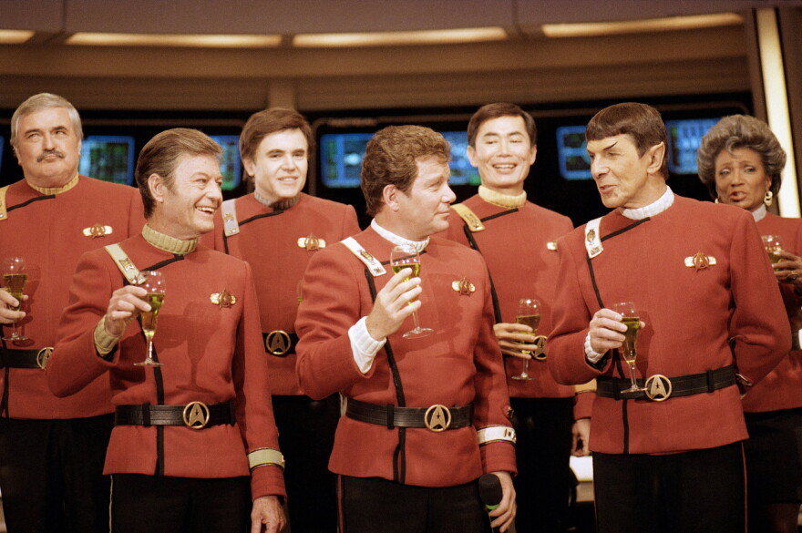 Dec. 28, 1988,  "Star Trek" crew, from left, James Doohan, DeForest Kelley, Walter Koenig, William Shatner, George Takei, Leonard Nimoy, and Nichelle Nichols, toast the newest "Star Trek" film during a news conference at Paramount Studios.