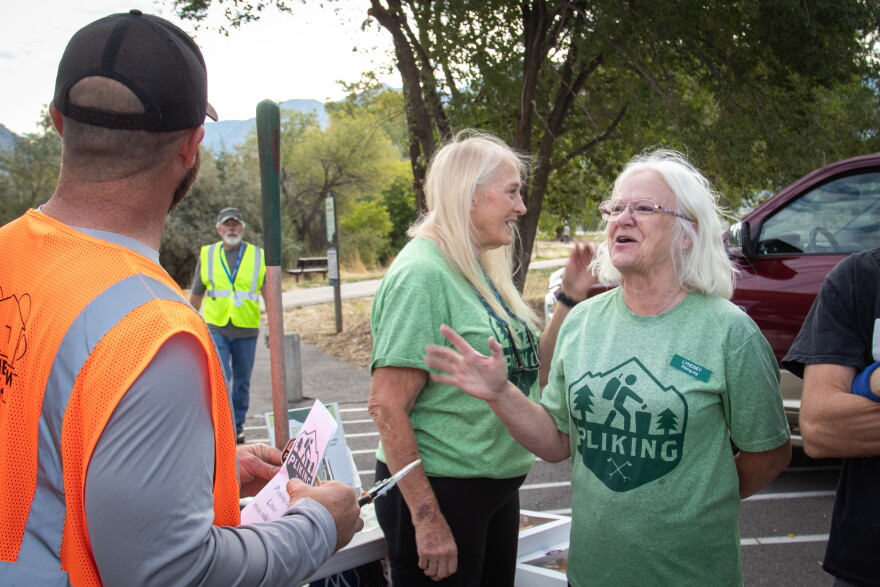 Malone and Sorrentino talk to volunteers about their group and the dangers of litter.