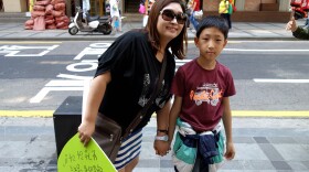 Choi Hyong-sook and her 11-year-old son during a march on Single Mother's Day. Her decision to raise him alone cost her ties with her family and a string of jobs.