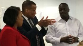 From L. to R.-Mayor Warren, Jay Williams of the U.S. Commerce Dept., and Tyrone Reaves, owner of Truform Manufacturing.