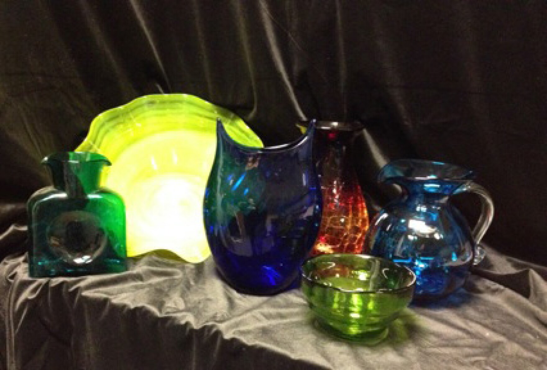 Peacock Water Bottle, Yellow Ruffled Bowl, Cobalt Twisted Vase, Tangerine Vase, Kiwi Bowl, and Turquoise Optic Pitcher from Blenko Glass