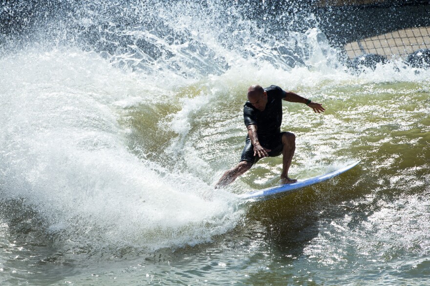 Surfers say the artificial wave at Kelly Slater Wave Co.'s pond has a natural feel. But the technology that creates it requires a several-minutes-long wait between swells.