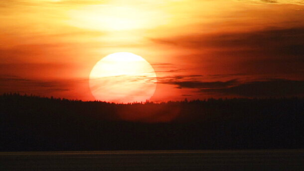 The sun sets over Eliott Bay, Friday, Jan. 13, 2012, in Seattle. 