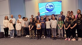 Onondaga County Executive Ryan McMahon and students from the East Syracuse-Minoa school district at an event for the Onondaga County aquarium.