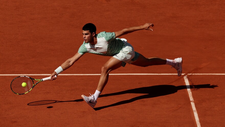 Carlos Alcaraz of Spain plays a forehand against Taro Daniel of Japan during a Second Round Match at the 2023 French Open at Roland Garros on May 31, 2023 in Paris, France.