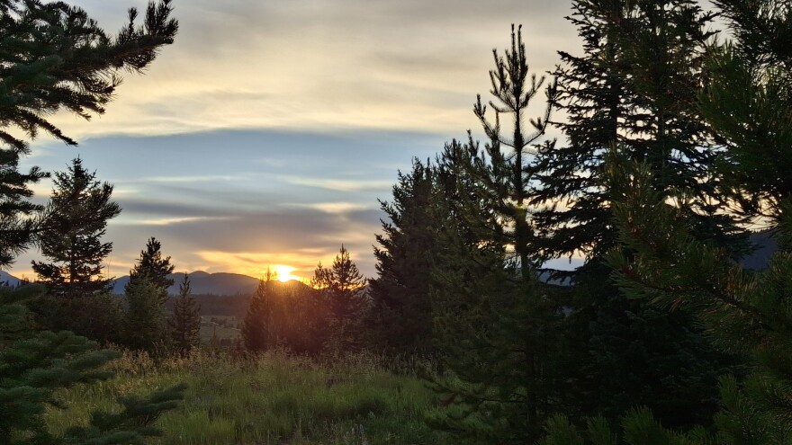 A sunset is seen from the campground at Pearl Lake State Park in Routt County, Colorado. Camp host Jan Tucker says the sunsets are one of her favorite things about spending summer as a camp host.